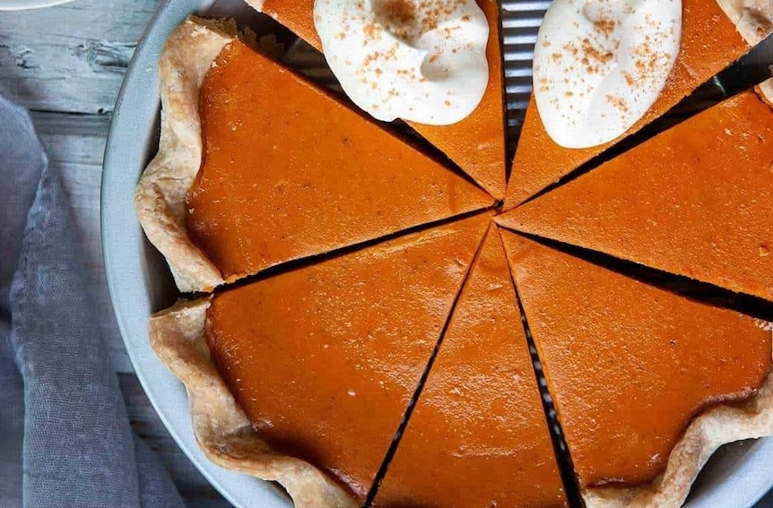 sweet potato pie with two dollops of white cream
